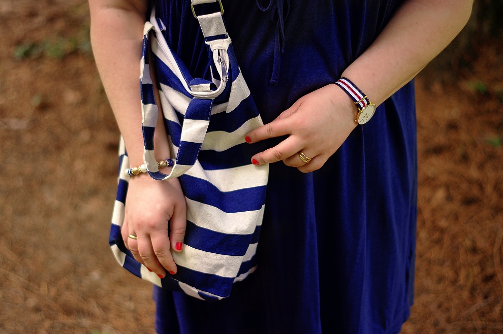 Navy dress and a striped bag